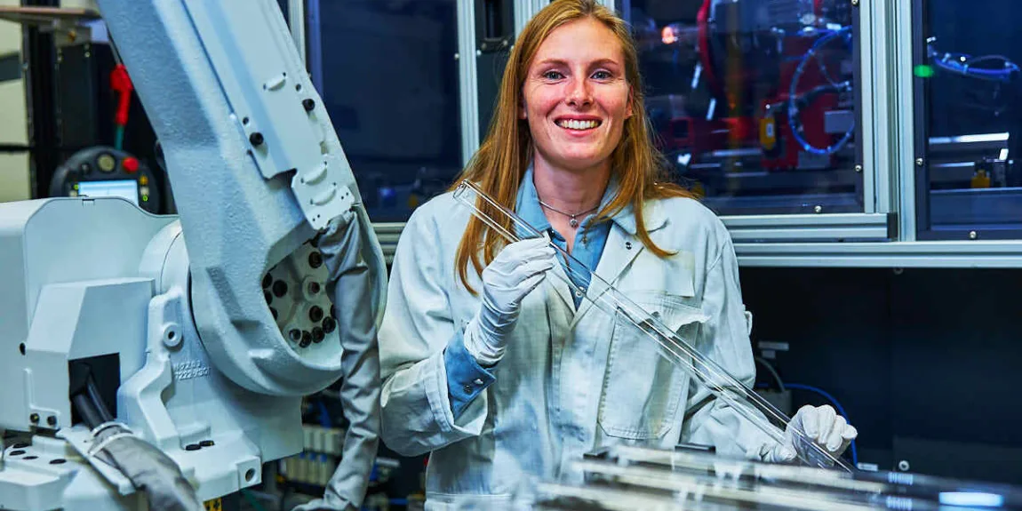 engineer holding a technical glass component